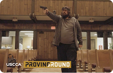 Man holding a gun in church